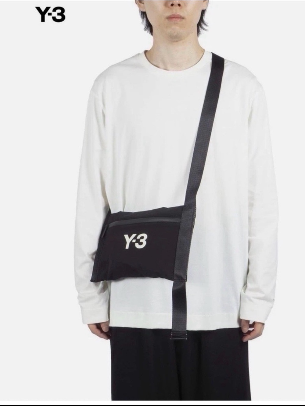 black Y-3 Classic Sacoche bag featuring a white logo and adjustable strap